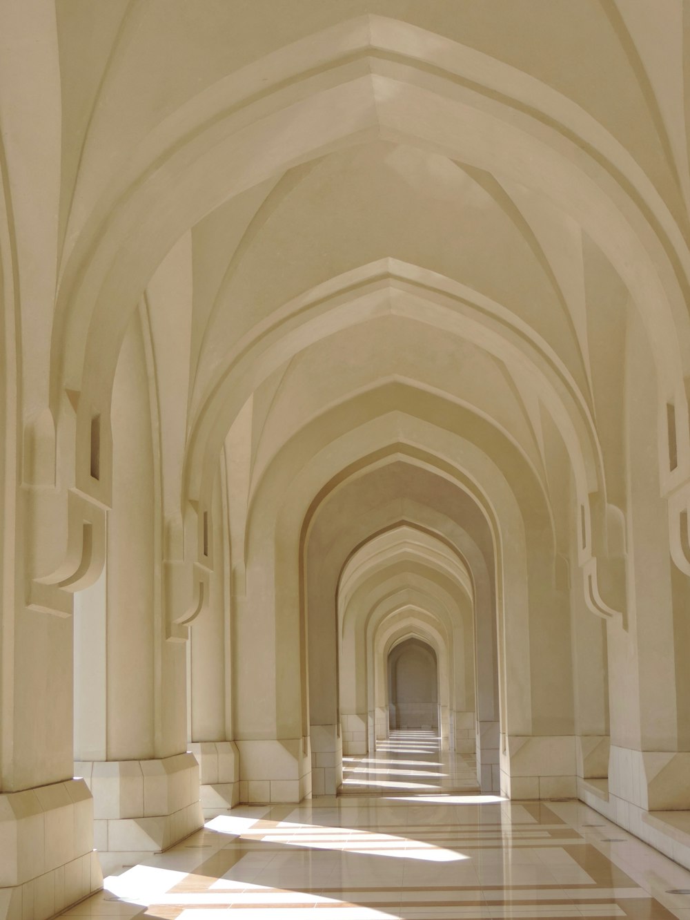 a hallway with arched ceilings