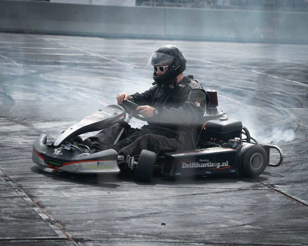 a person driving a go kart