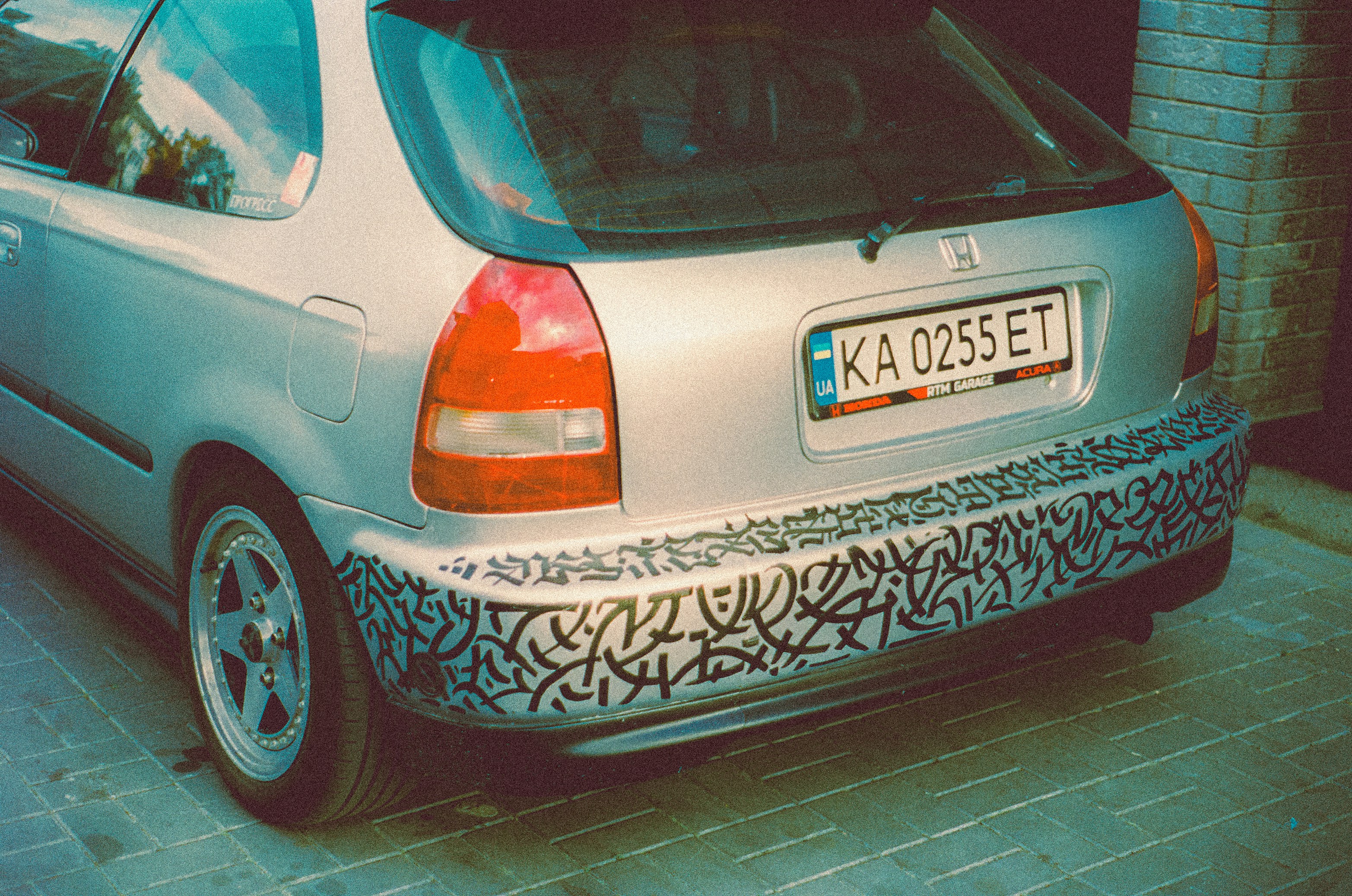 a car parked on a brick road