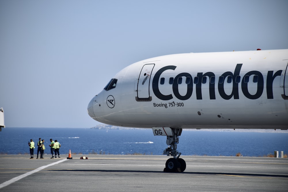 a large white airplane on a runway