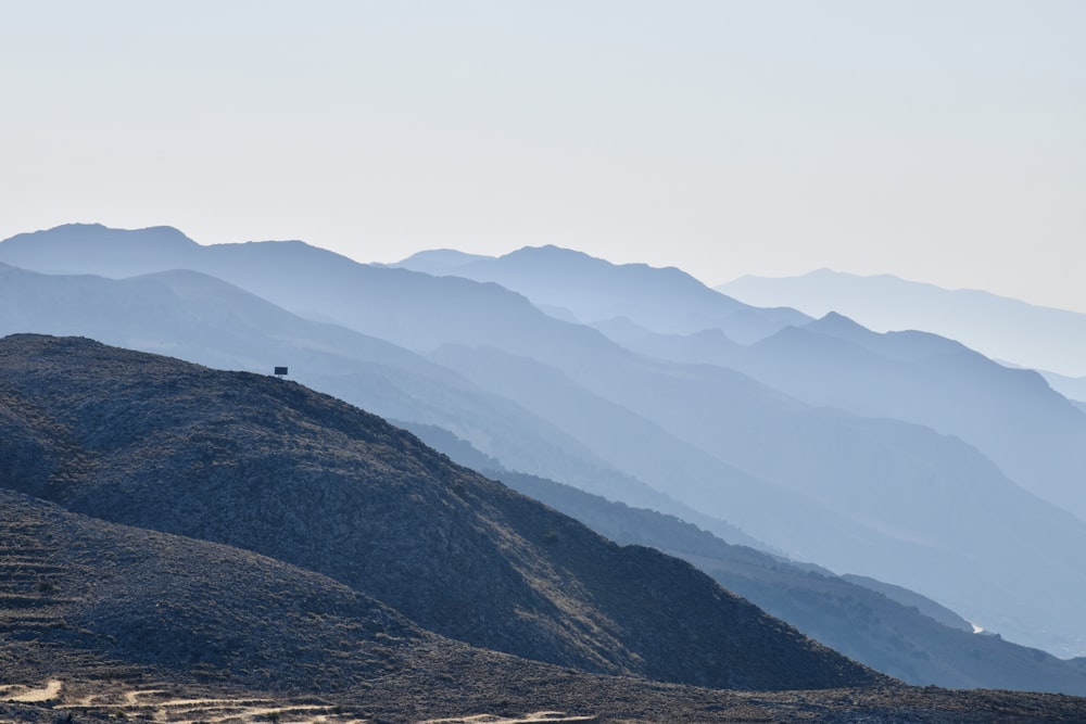 a landscape with hills and a blue sky