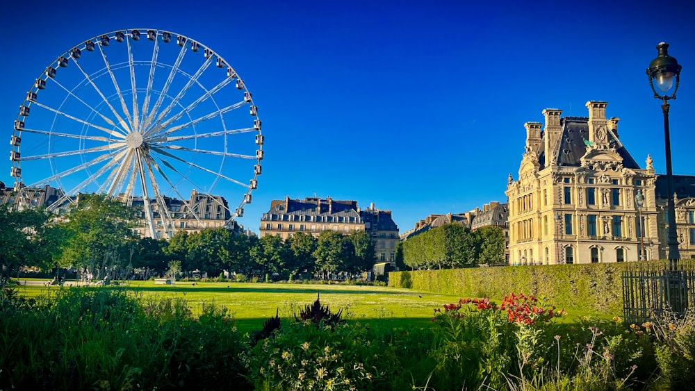 a large ferris wheel next to Tuileries Garden