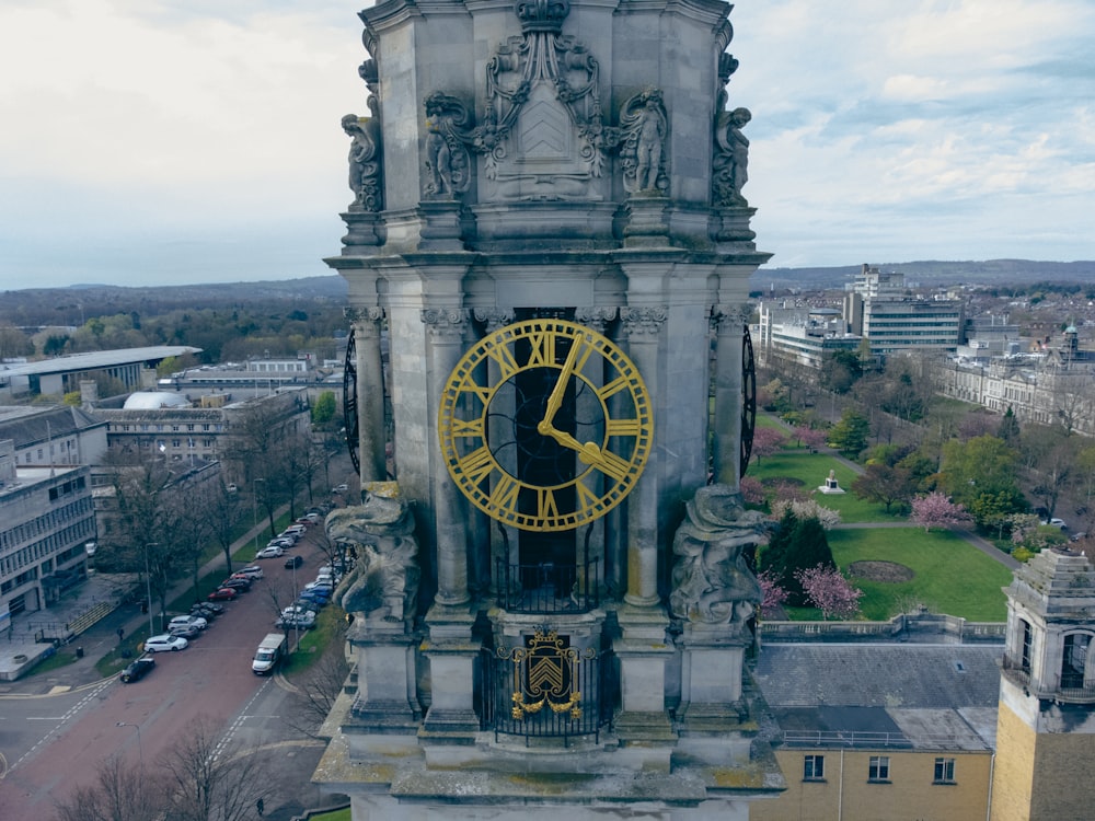 a large clock on a stone tower