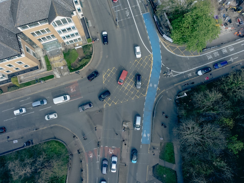 a road with cars on it and buildings around it