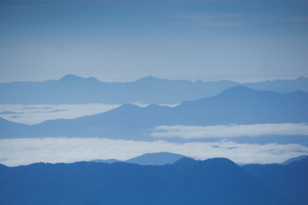 a view of the mountains and clouds