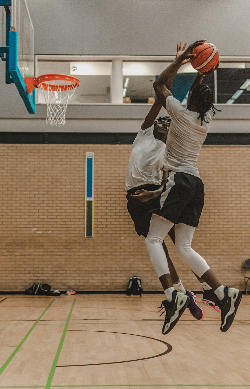 a couple of women playing basketball