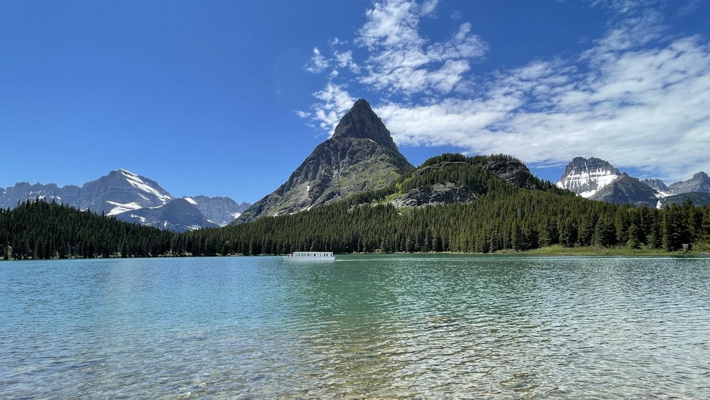 a lake with mountains in the background