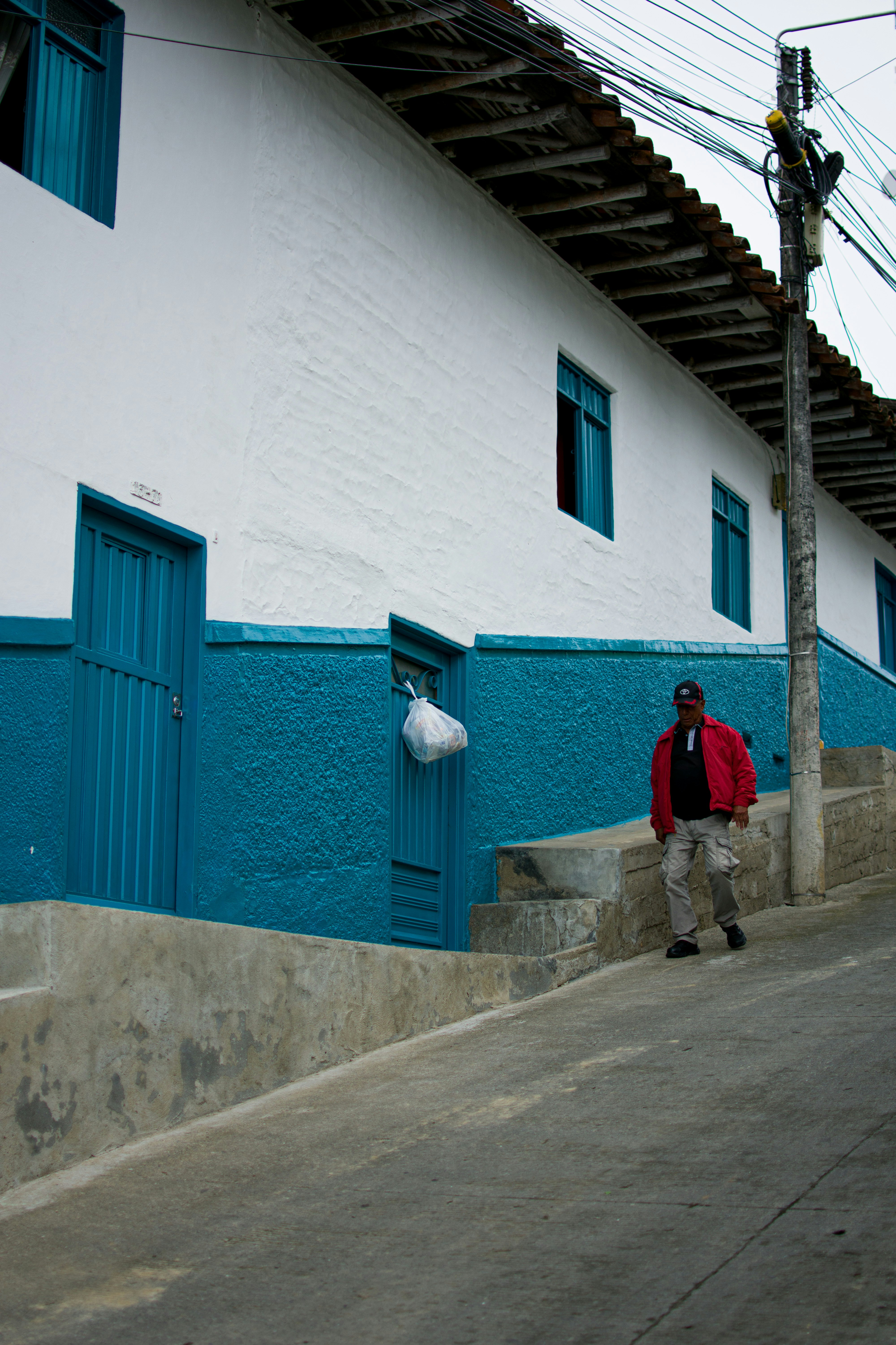 a man standing on a sidewalk