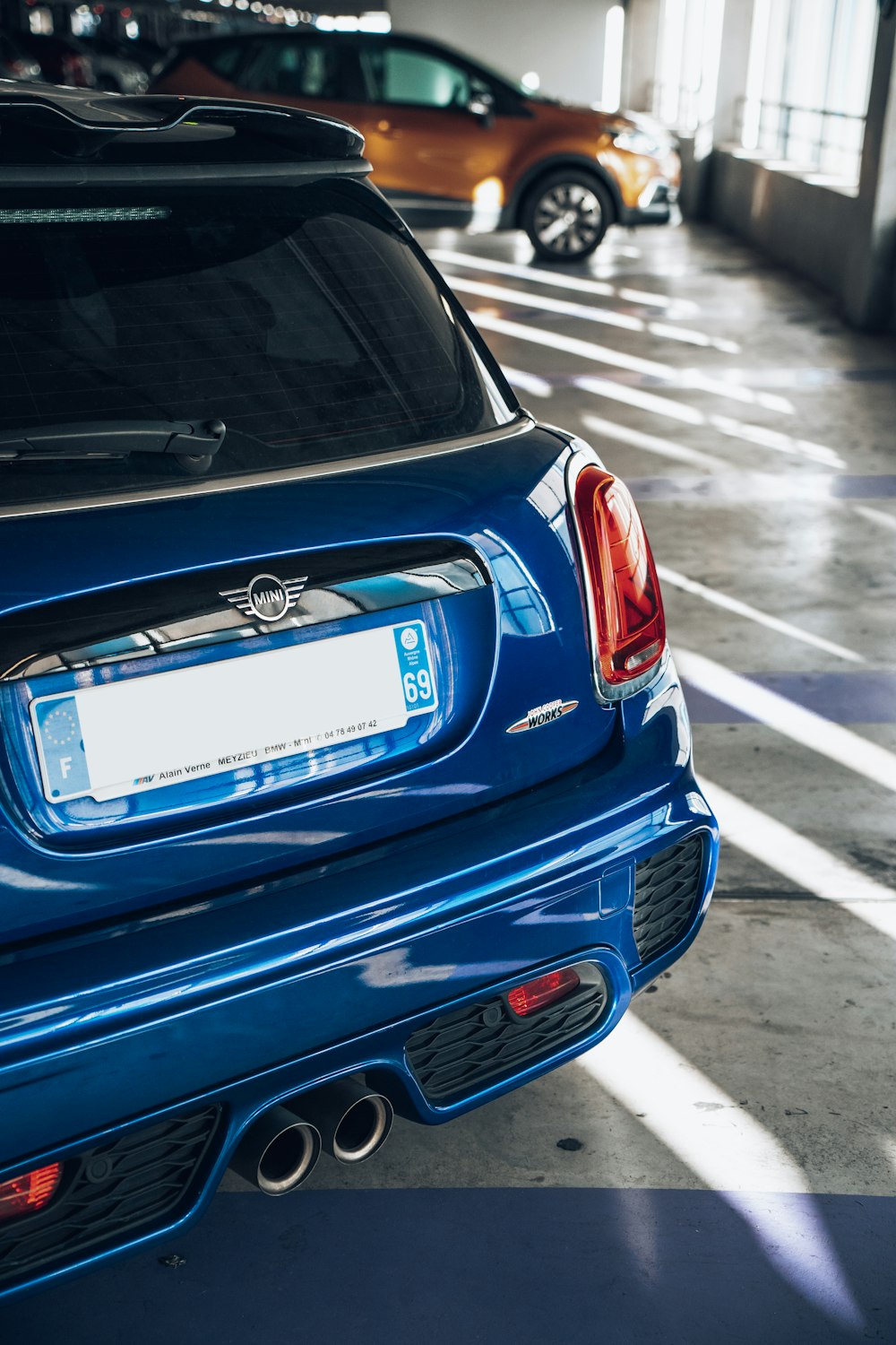 a blue car parked in a parking lot