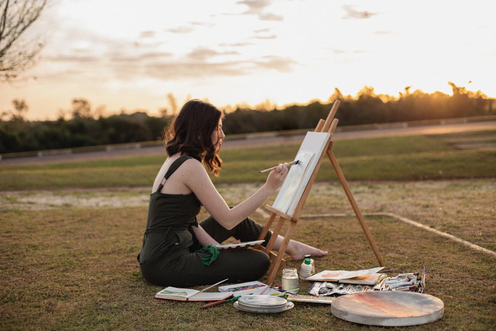 a woman painting outside