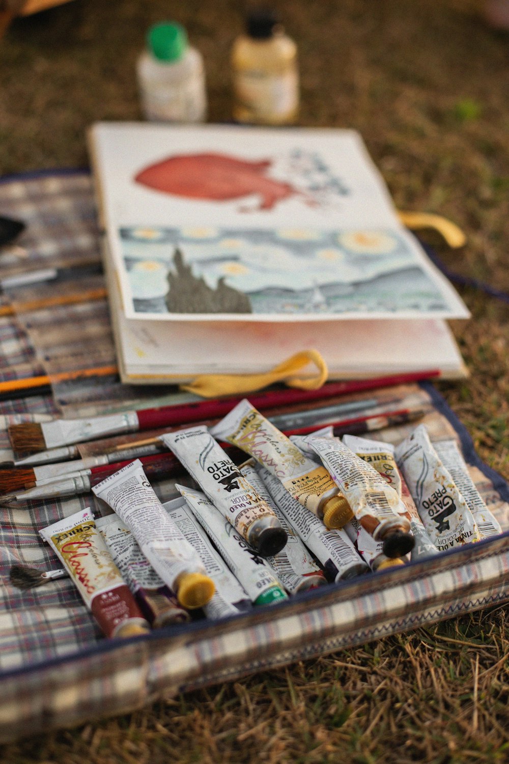 a box of paints and paint brushes