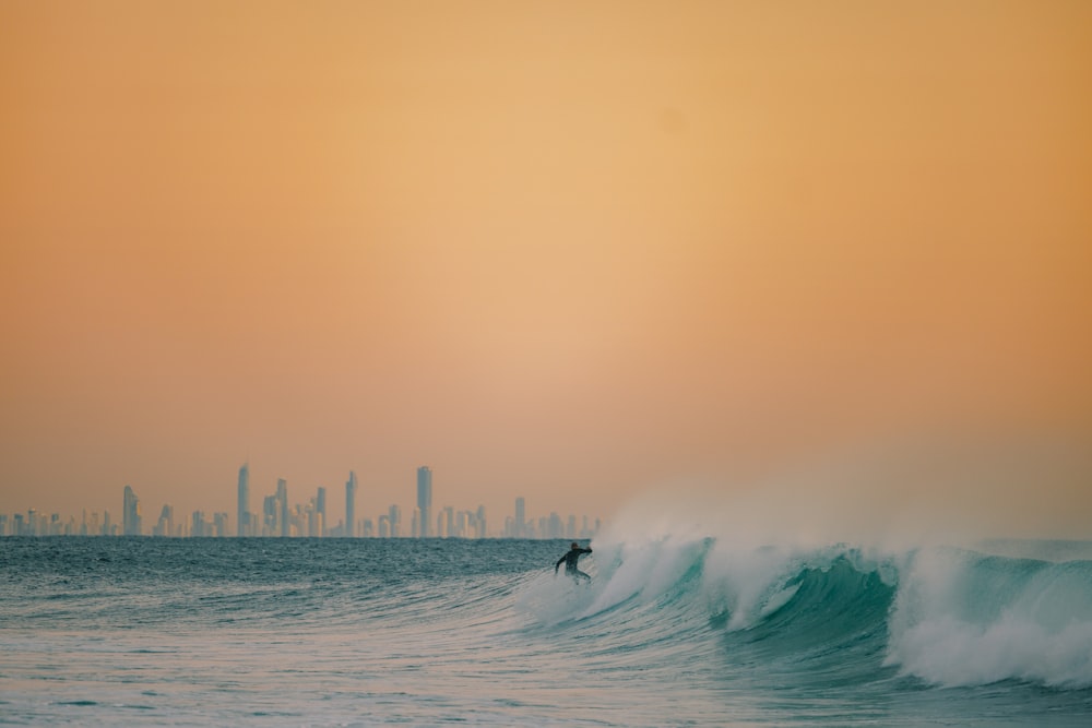 a person surfing on the waves