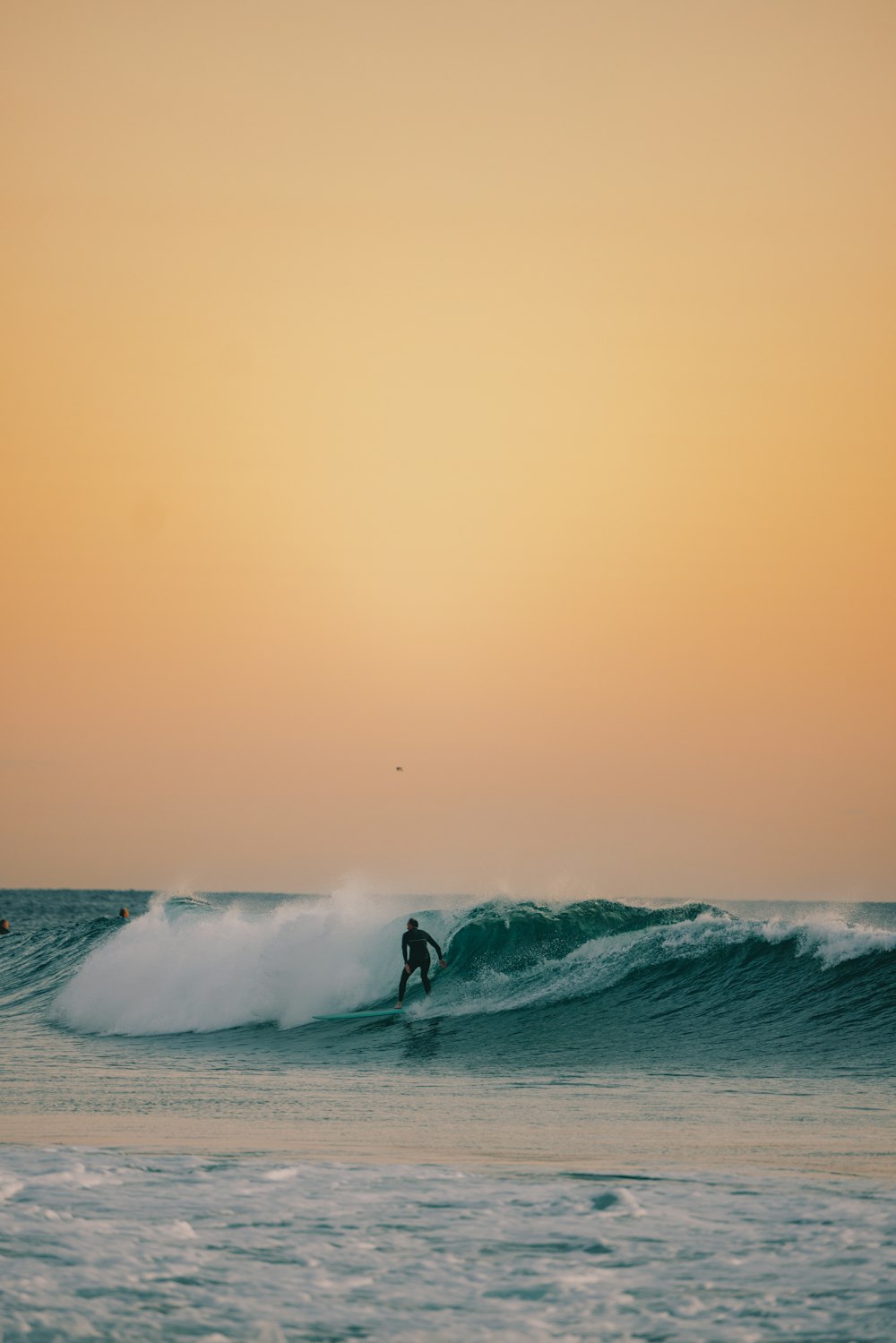 a person surfing on the waves