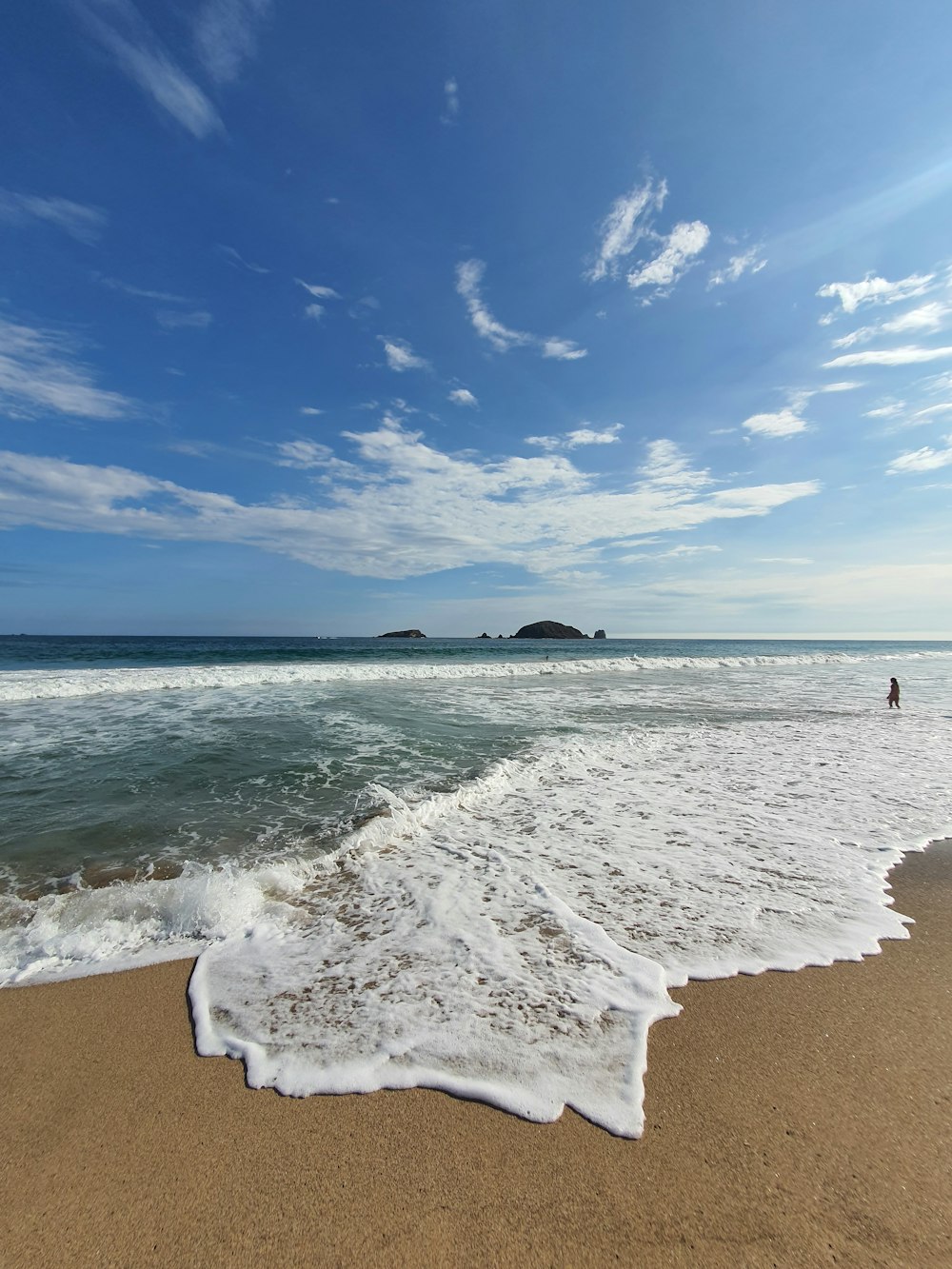 a person walking on a beach