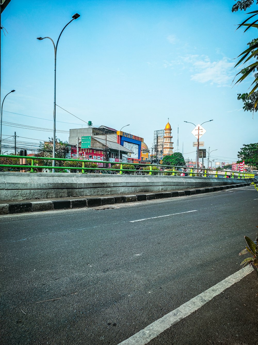 a road with a building in the background