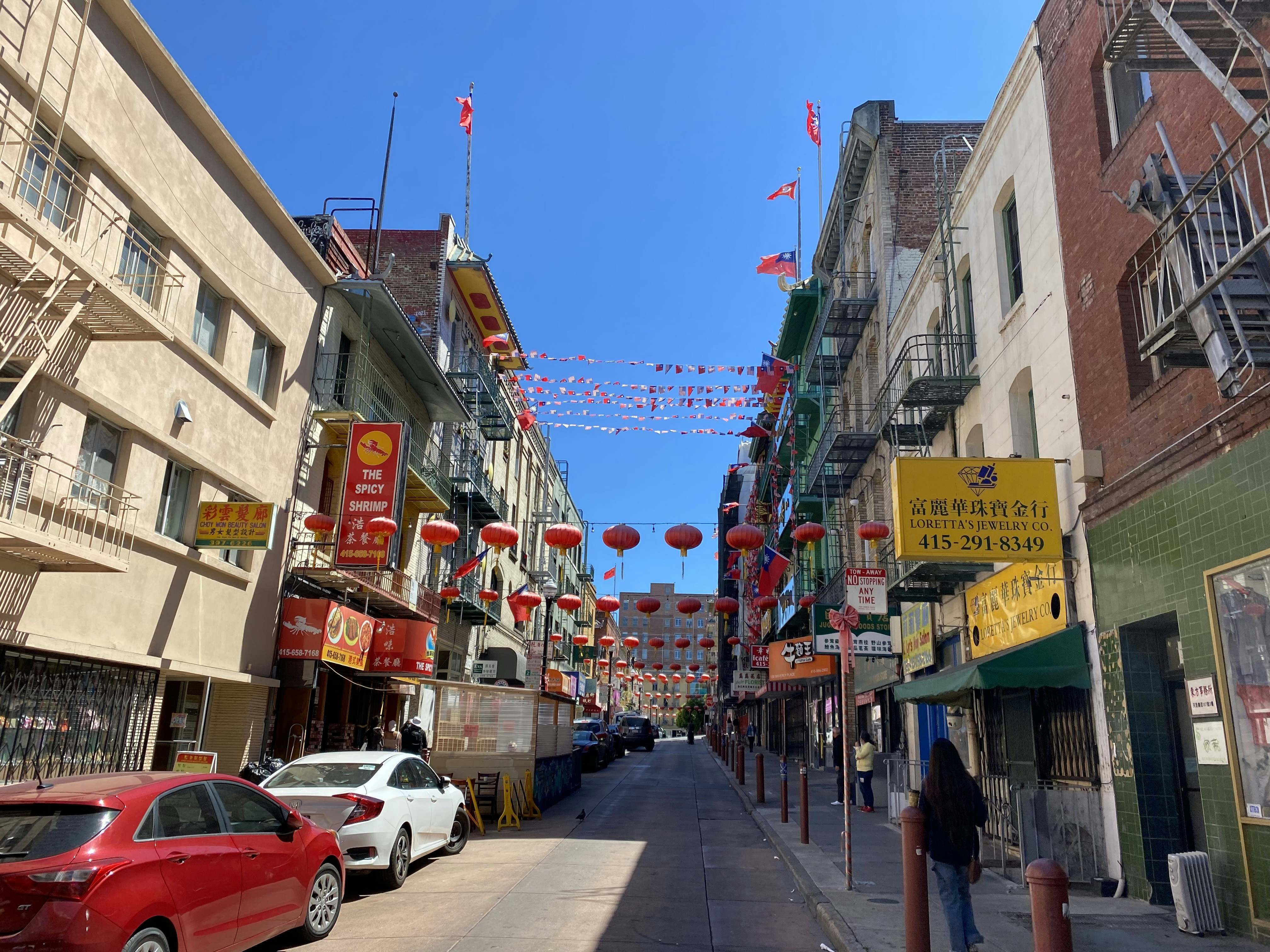 a street with cars and buildings on either side of it