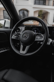 the steering wheel and dashboard of a car