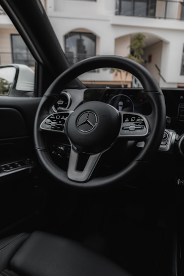 the steering wheel and dashboard of a car