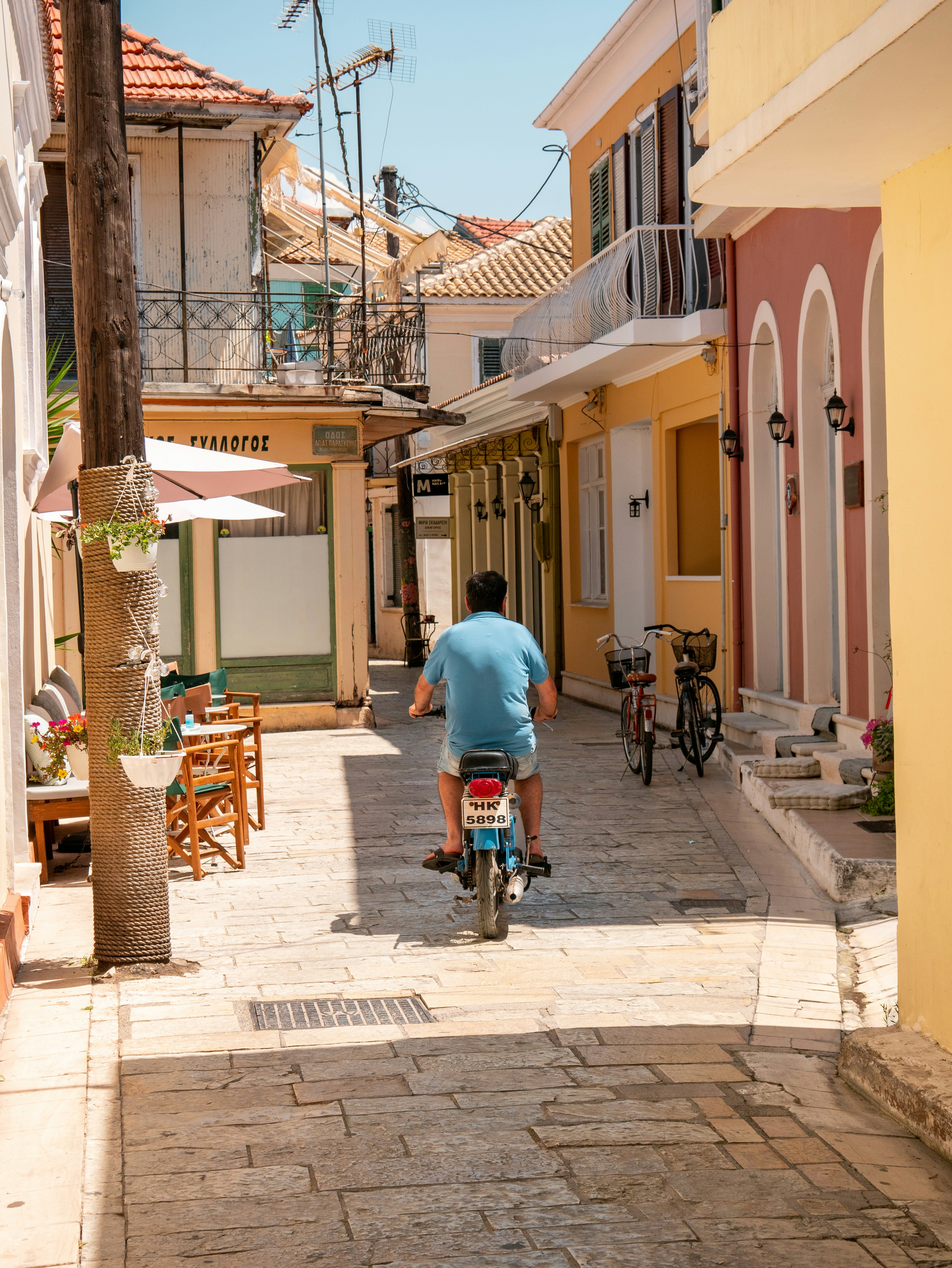 a person riding a bicycle down a street