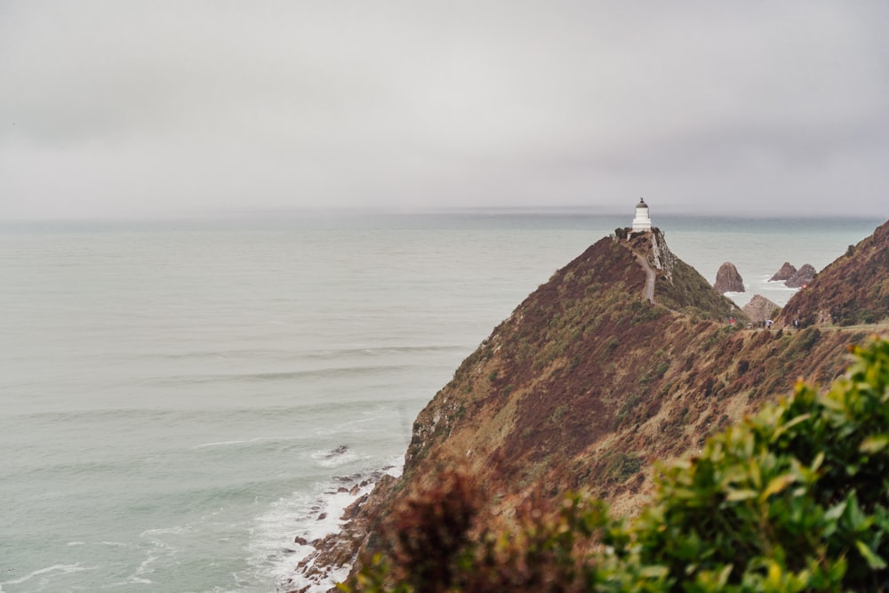 a lighthouse on a rocky cliff