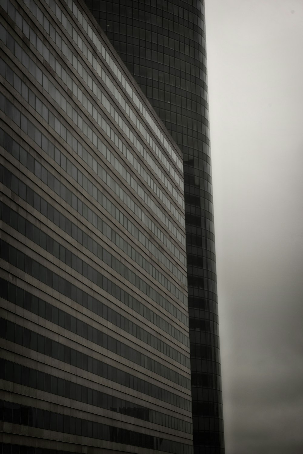 a tall building with a cloudy sky