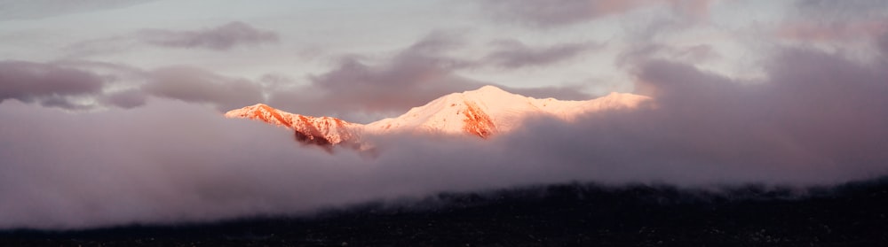 a mountain with clouds