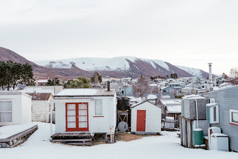 a group of buildings in a snowy area