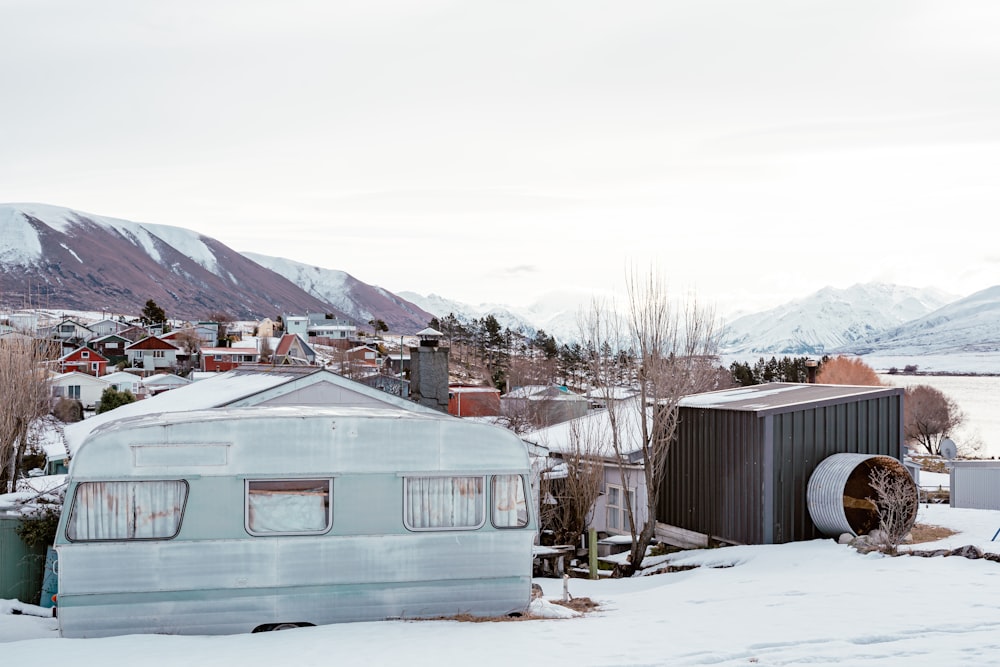 a group of buildings in a snowy area