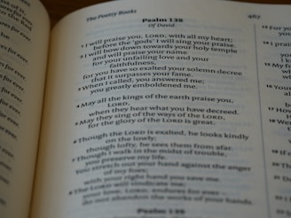 A close-up view of a page from a religious text, possibly a Bible, focusing on Psalm 138. The text is printed in a classic serif font on a slightly yellowed page, suggesting age or frequent use.