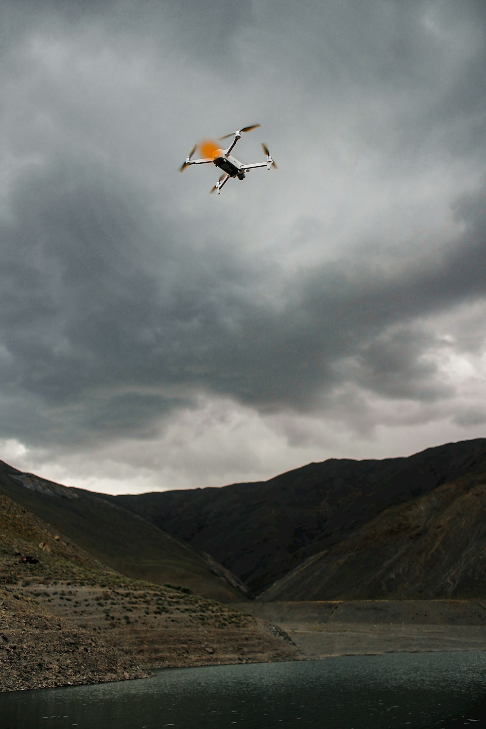 a drone flying over a river