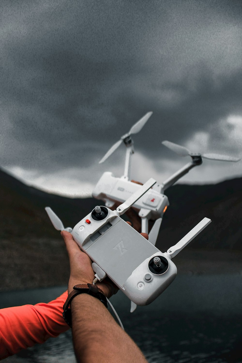 a person holding a drone