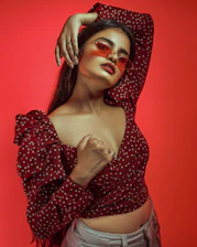 Edgy street-style profile page mockup with bold red accents and a fierce attitude.