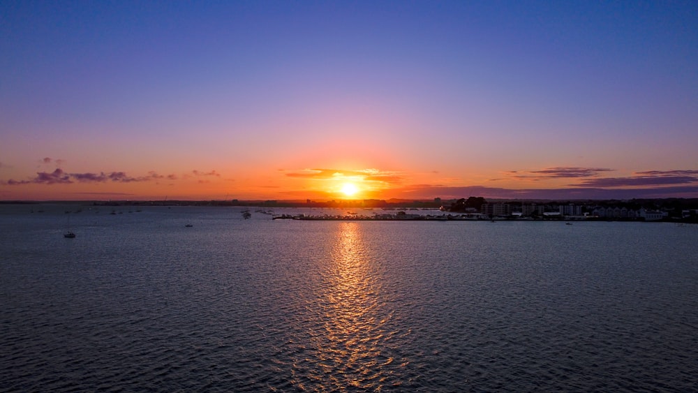 a sunset over a body of water