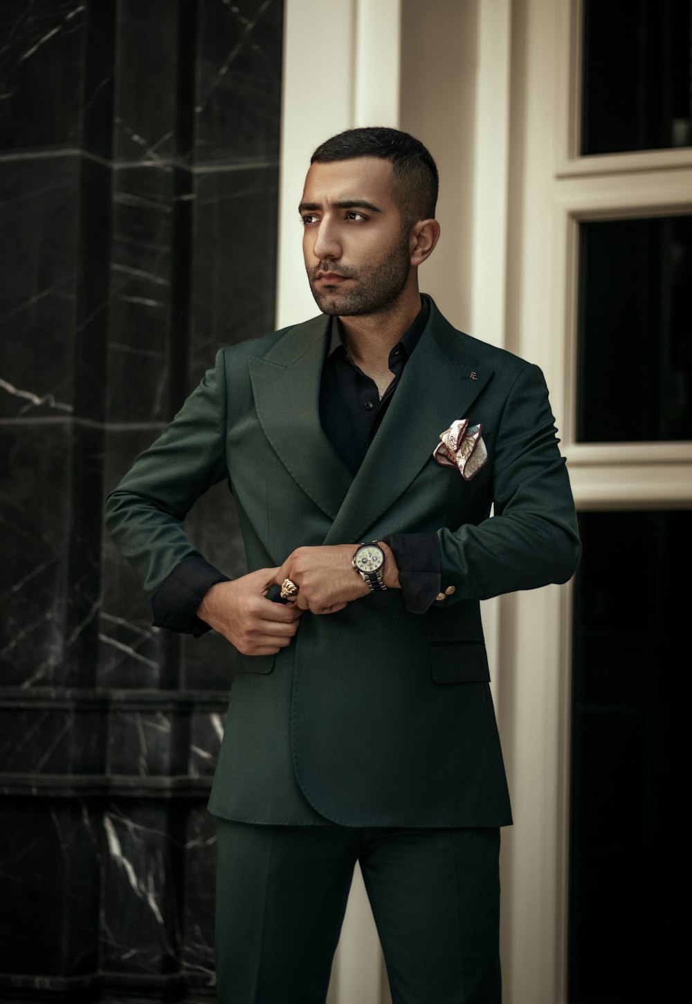 a man in a green jacket