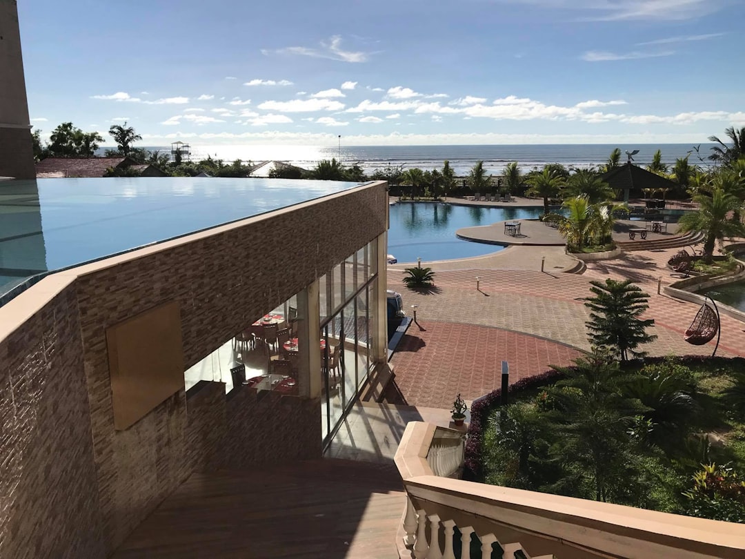 a pool and a building, Sea Pearl Beach Resort & Spa Cox