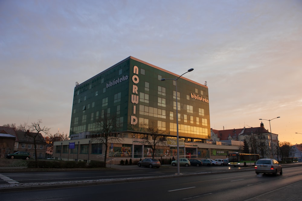 a large building with a parking lot