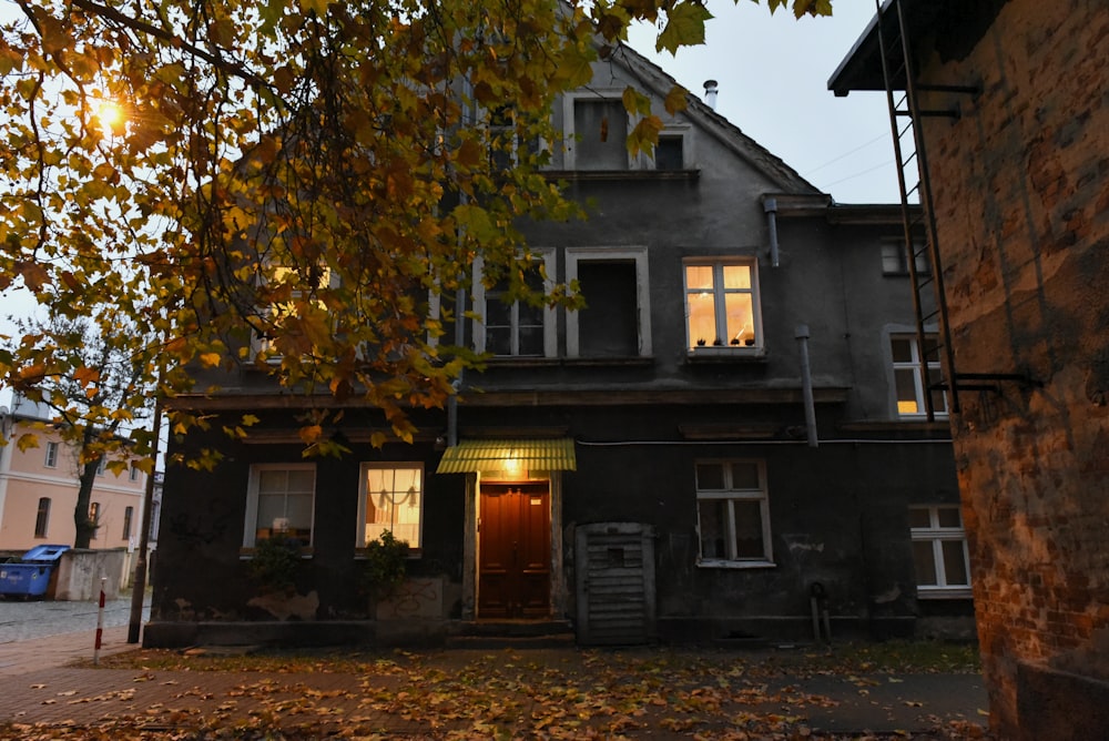 a house with a tree in the front