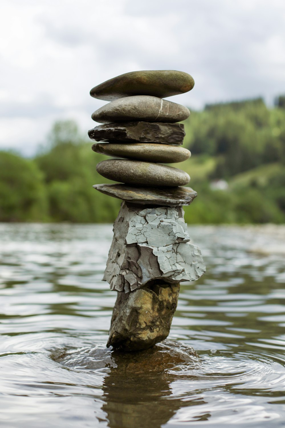 a stack of rocks in the water