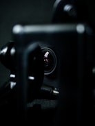 Dynamic close-up of a camera lens capturing a moving subject.