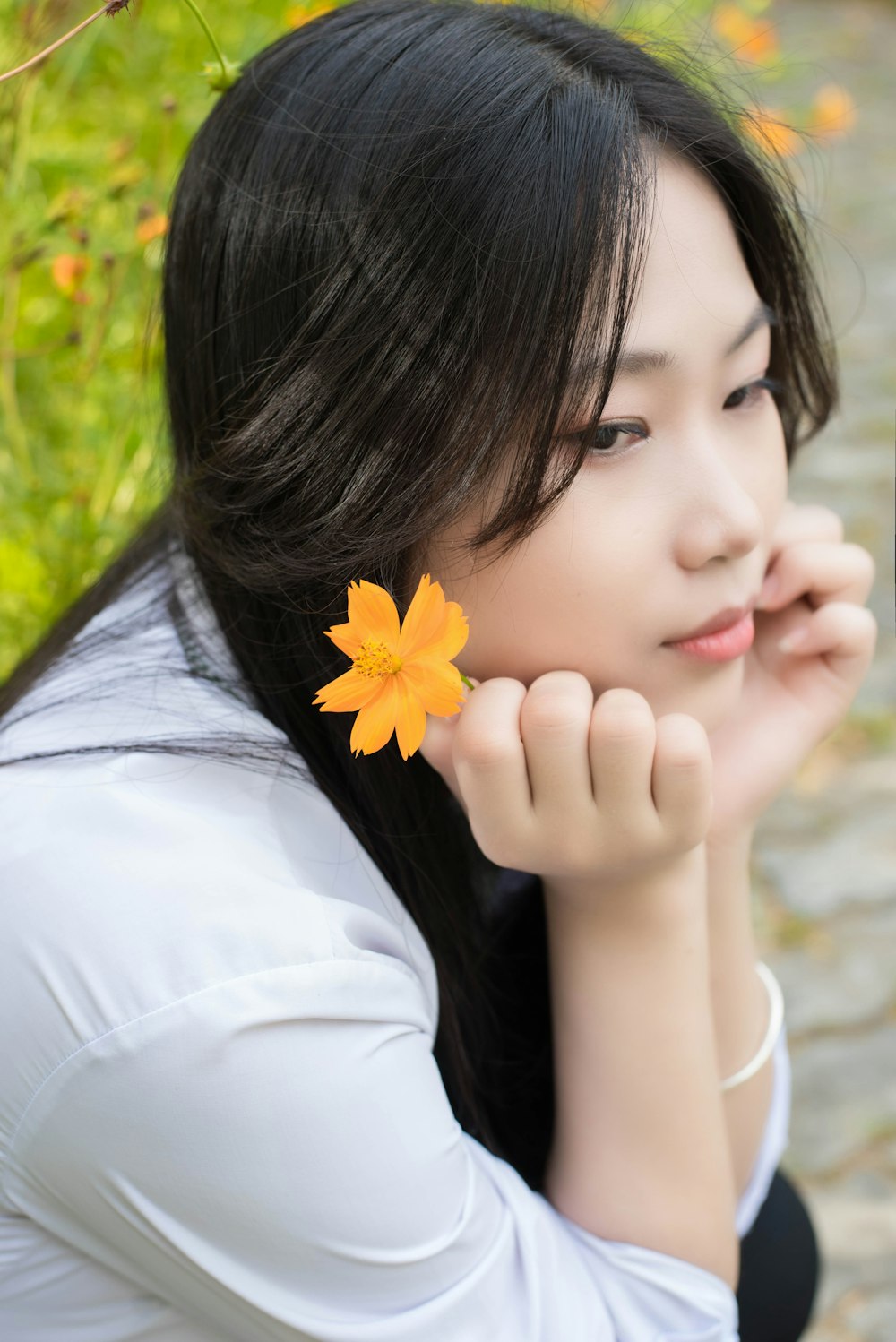 a woman with a flower in her hair