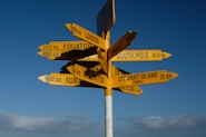 a signpost with several arrows