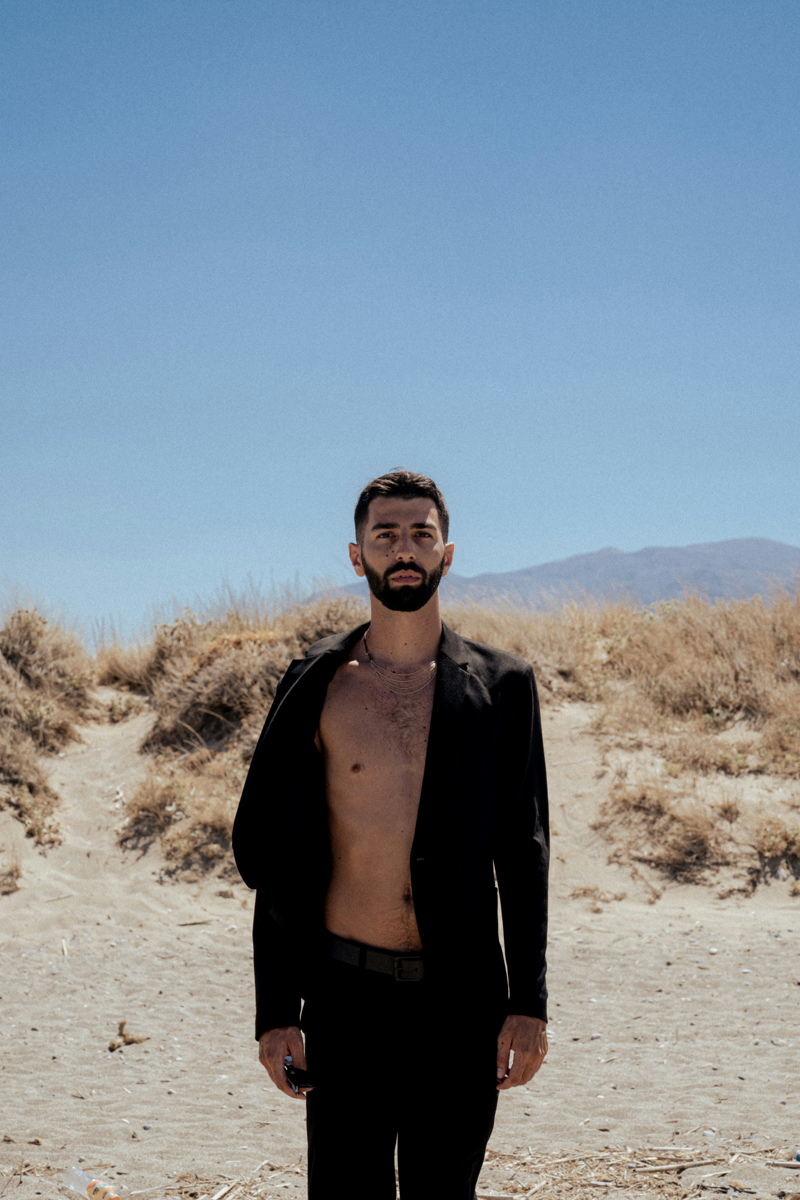 a man standing in the sand
