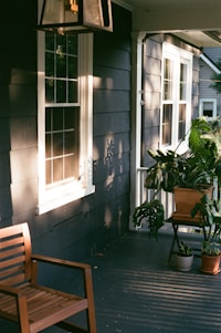a bench next to a window