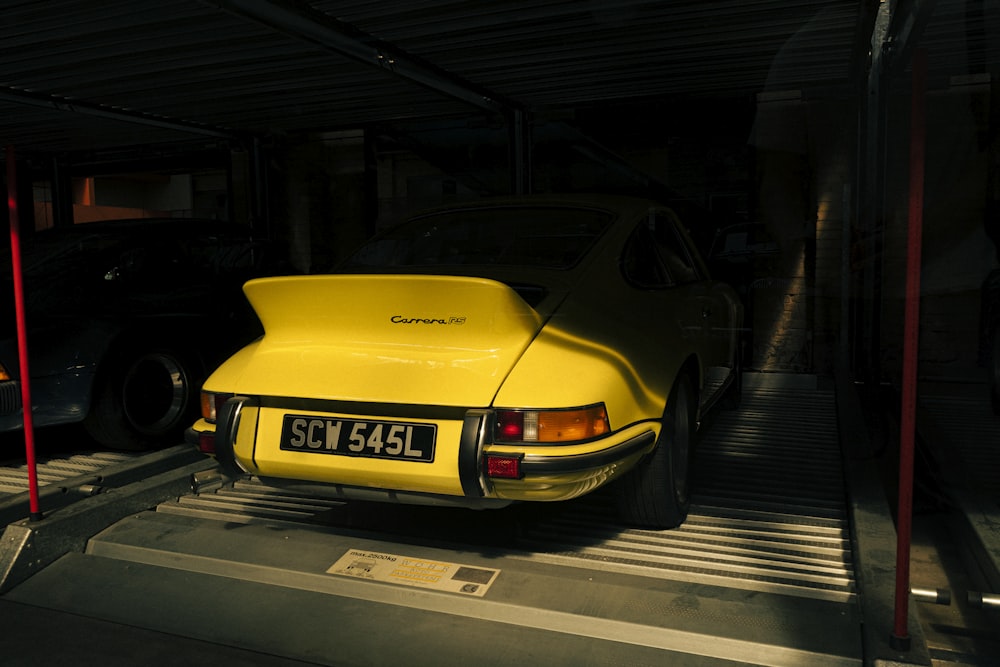 a yellow car parked in a garage