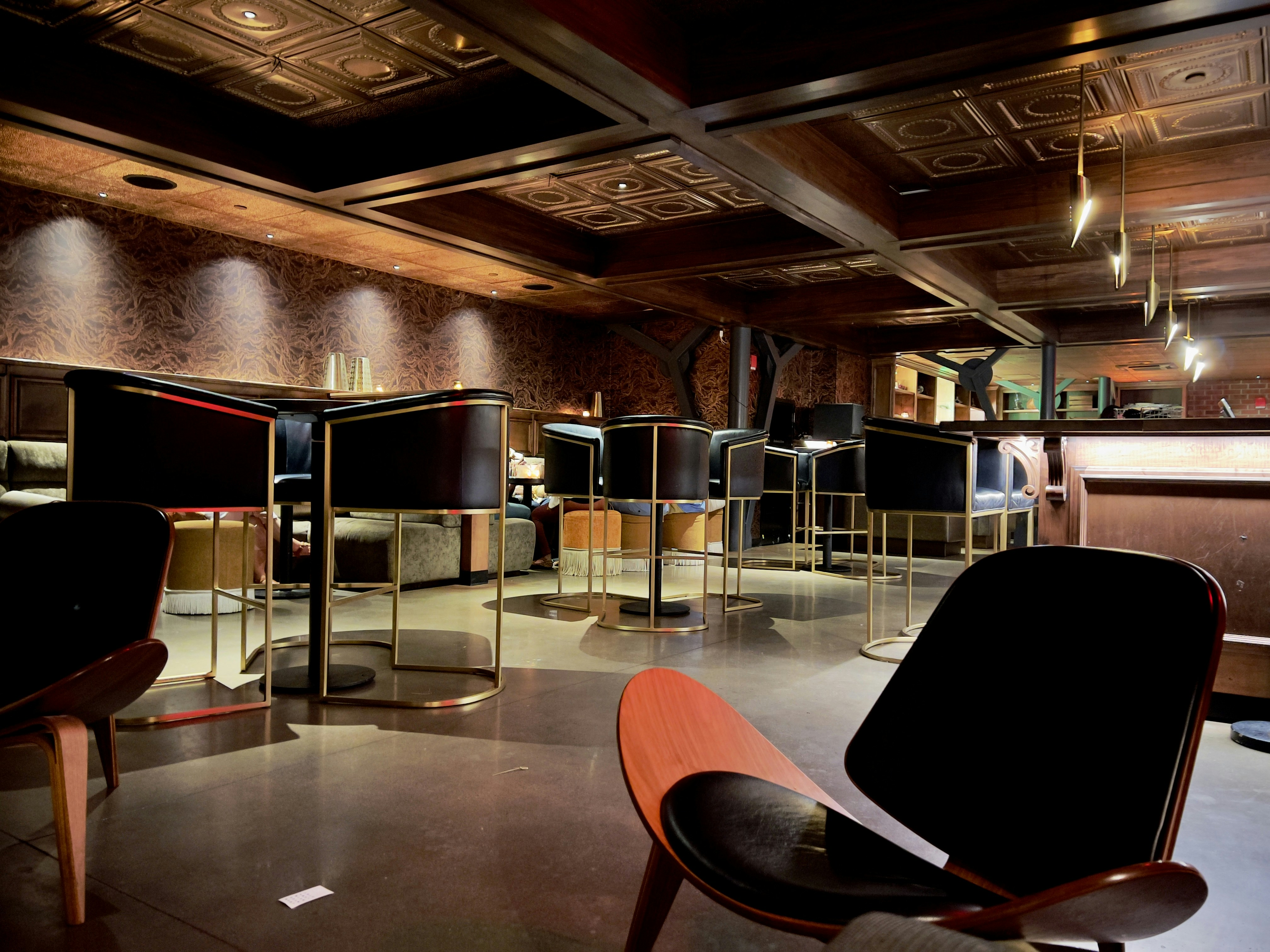 a room with chairs and tables, 