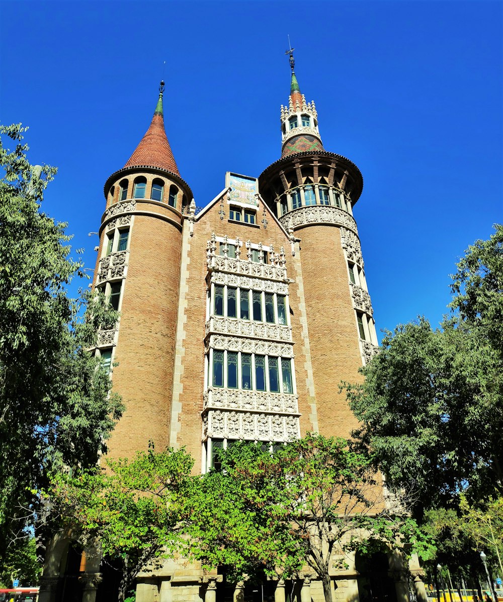 a large brick building with trees in front of it