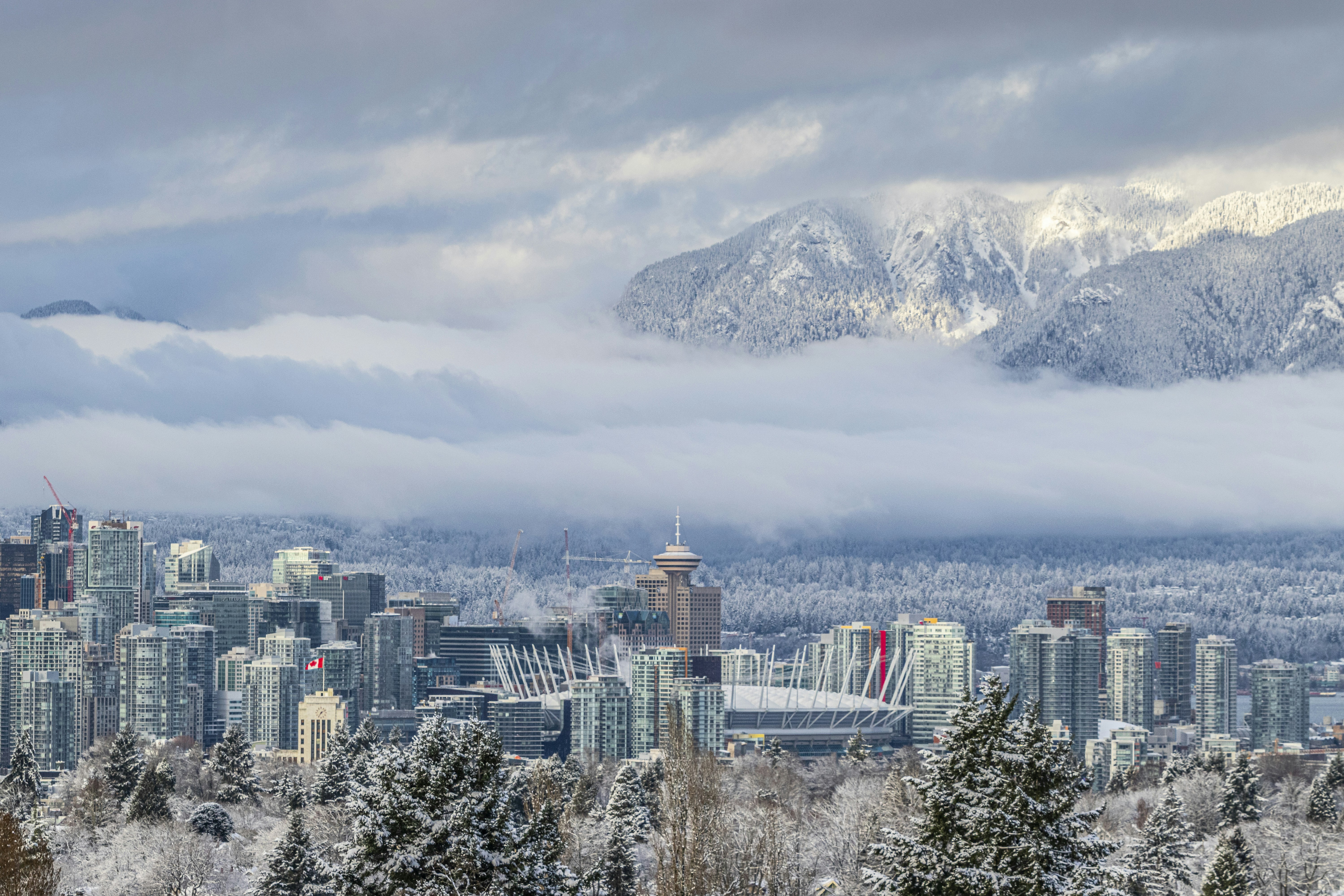 a city with snow covered mountains