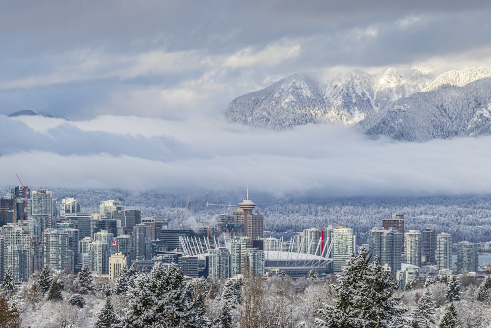 a city with snow covered mountains