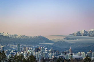 a city with snow covered mountains