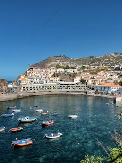 A charming seaside village in Crete with colorful fishing boats bobbing gently in the harbor.